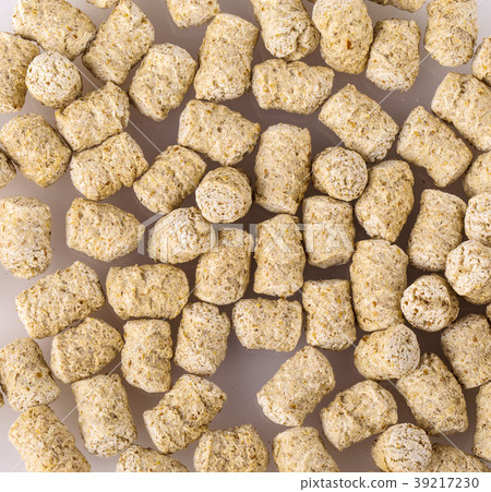 Top view of extruded wheat bran pellets Top view of extruded wheat bran pellets 39217230
