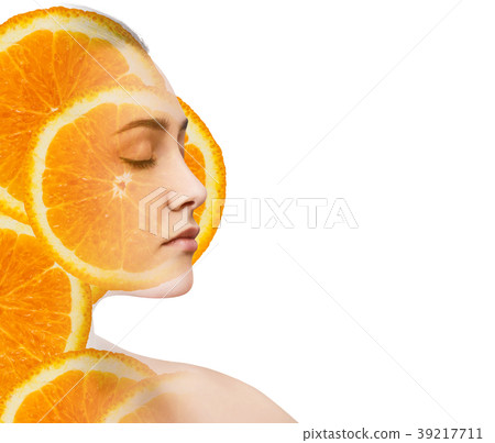 Double exposure of woman with orange fruit slices. Double exposure of woman with orange fruit slices. 39217711