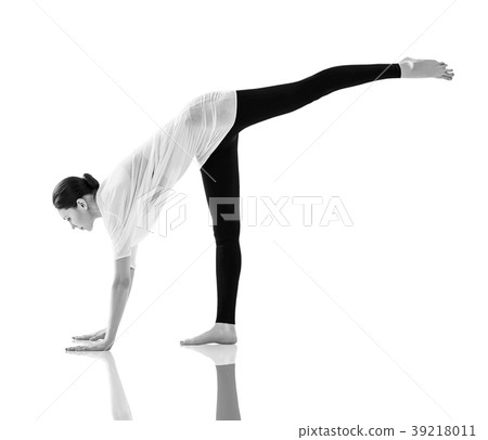 Young woman doing yoga exercise on the floor. Young woman doing yoga exercise on the floor. 39218011