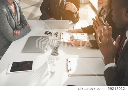 Business partners discussing work issues Business partners discussing work issues 39218012