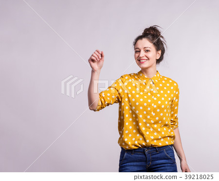 Portrait of a young beautiful woman in studio. 39218025