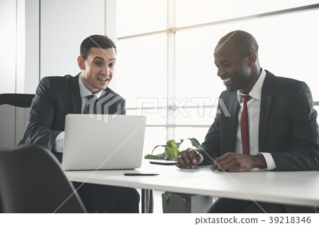 Two happy men talking about business 39218346