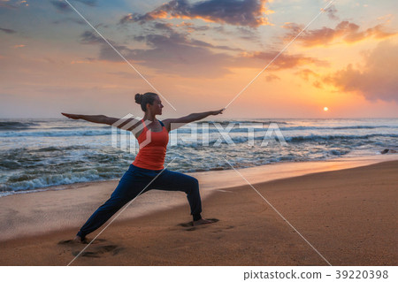 Woman doing yoga asana Virabhadrasana 1 Warrior 39220398