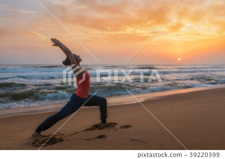Woman doing yoga asana Virabhadrasana 1 Warrior Woman doing yoga asana Virabhadrasana 1 Warrior 39220399