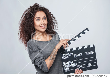Female holding movie clapper board 39220447