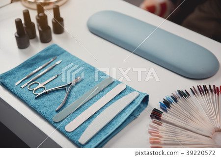 Tools for preparing manicure on table 39220572