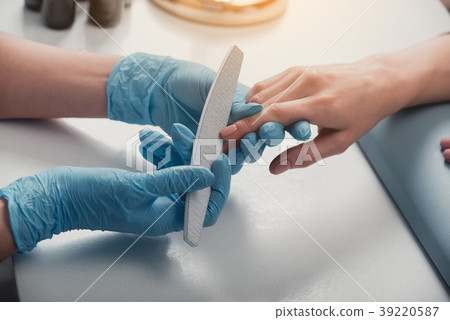 Woman arm having manicure on table 39220587