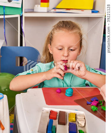 Plasticine modeling clay. Child dough play in Plasticine modeling clay. Child dough play in 39221128