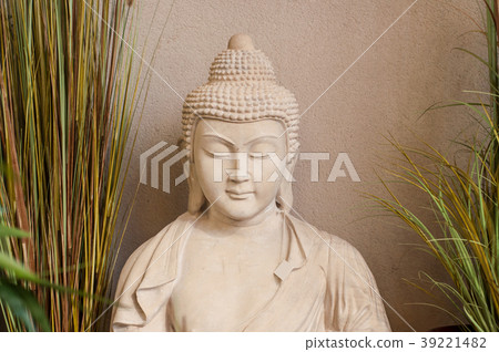 stoned buddha in gardening store 39221482