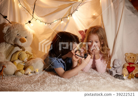 Joyful children playing in toy tent Joyful children playing in toy tent 39222521