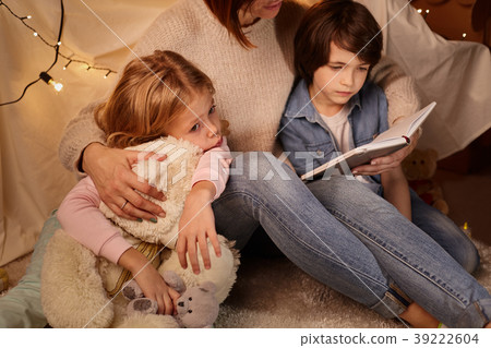 Mom and kids in cozy nursery 39222604