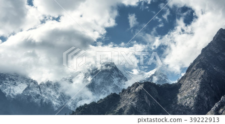 Majestical scene with mountains in clouds Majestical scene with mountains in clouds 39222913