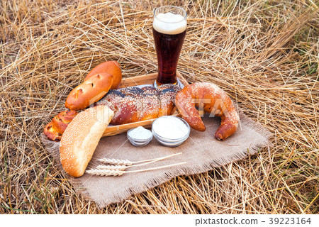 Glass of beer or kvass and breads on tablecloth 39223164
