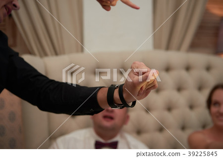 Magician shows trick at wedding ceremony Magician shows trick at wedding ceremony 39225845