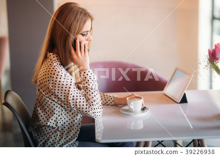 beautiful blond lady use different gadgets and 39226938