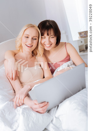 Nice positive woman hugging her girlfriend 39228049