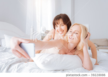 Nice cheerful woman taking a selfie 39228086