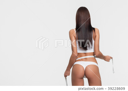 Young beautiful girl measures your body parts of 39228609
