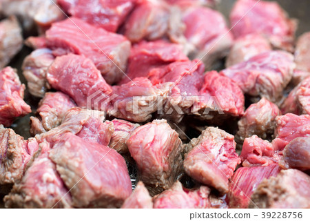 Pieces of beef cooking in frying pan Pieces of beef cooking in frying pan 39228756