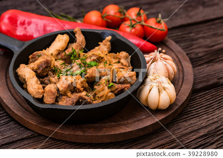 Fried pork in frying pan and vegetables 39228980