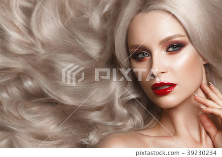 Beautiful blonde in a Hollywood manner with curls 39230234