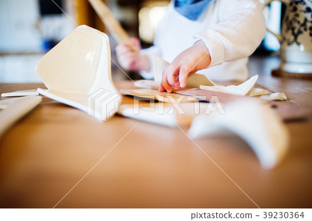 Toddler boy in dangerous situation at home. Child 39230364