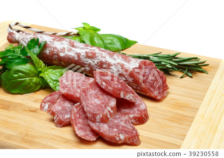 Dried sliced organic salami sausage on wooden Dried sliced organic salami sausage on wooden 39230558
