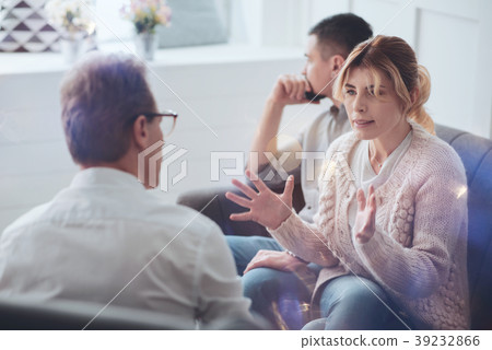 Depressed moody woman talking to the therapist 39232866