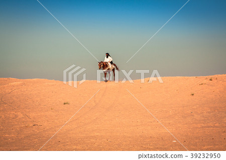 Local people on horses, in the famous Saraha Local people on horses, in the famous Saraha 39232950