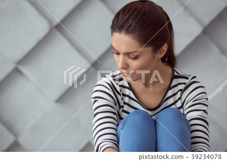 Sad depressed woman closing her eyes 39234078