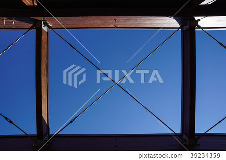 Wood structure framing for a pergola against a Wood structure framing for a pergola against a 39234359