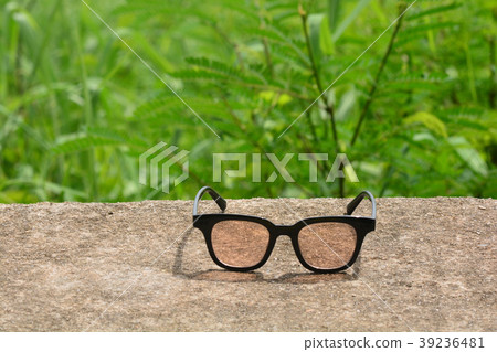 hipster glasses on a park bench or table 39236481