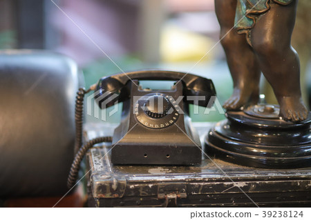 Old black phone livingroom. 39238124