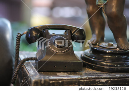 Old black phone livingroom. 39238126