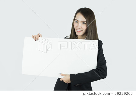 Asian businesswoman holding blank white card board Asian businesswoman holding blank white card board 39239263