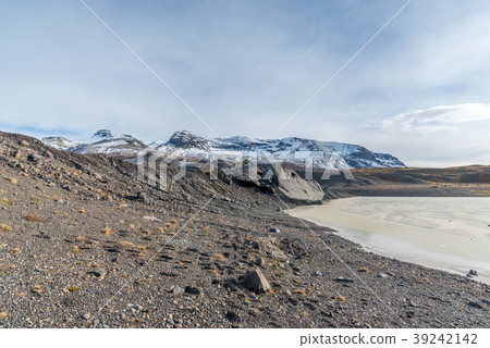 Mountains, valleys and volcano near ice cave 39242142