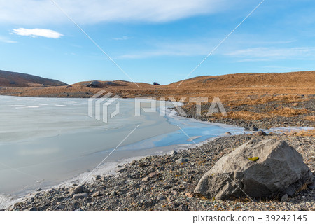 Mountains, valleys and volcano near ice cave 39242145