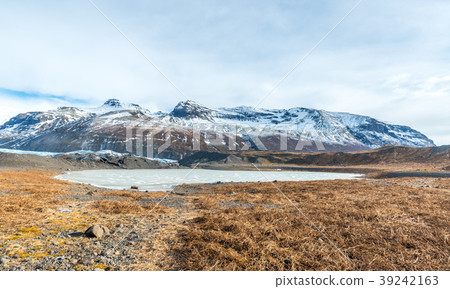 Mountains, valleys and volcano near ice cave 39242163