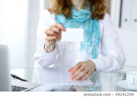 Close-up of business woman giving a visit card 39242209