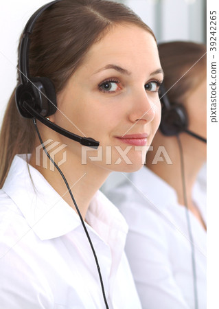 Call center. Focus on beautiful woman in headset 39242265