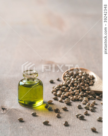 Hemp seeds and hemp oil, copy space. Vertical 39242348