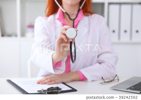 Doctor with a stethoscope in the hands 39242502