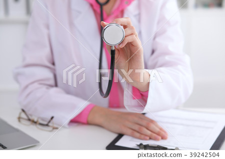 Doctor with a stethoscope in the hands Doctor with a stethoscope in the hands 39242504