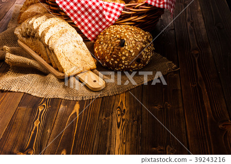 Bakery Assortment on wood table on dark background Bakery Assortment on wood table on dark background 39243216