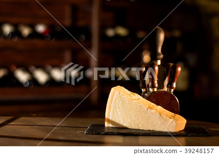 Cheese and accessories placed on a wooden table in Cheese and accessories placed on a wooden table in 39248157