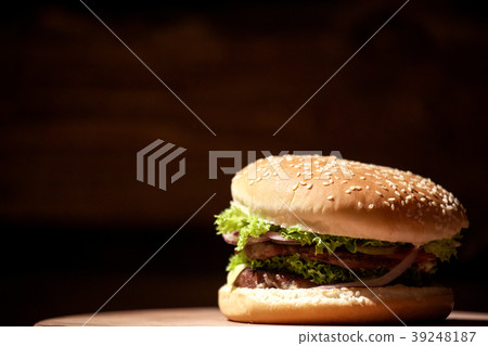 Close-up shot of big, delicious meat burger placed 39248187