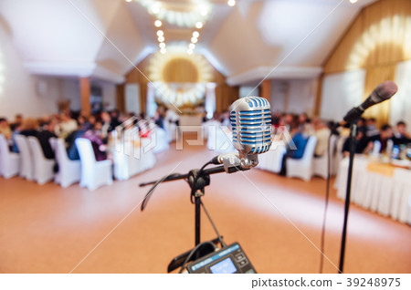 Microphone on blurred of speech in seminar room Microphone on blurred of speech in seminar room 39248975