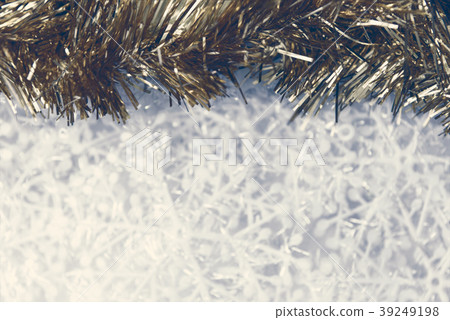 Christmas ornaments background - gold tinsel on sn Christmas ornaments background - gold tinsel on sn 39249198