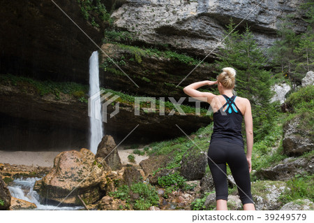 Active sporty woman under a Pericnik waterfall 39249579