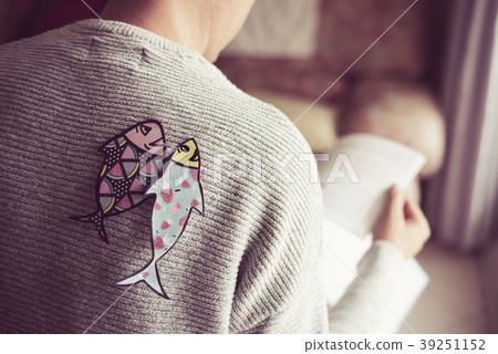 paper fishes in back of man for april fools day 39251152